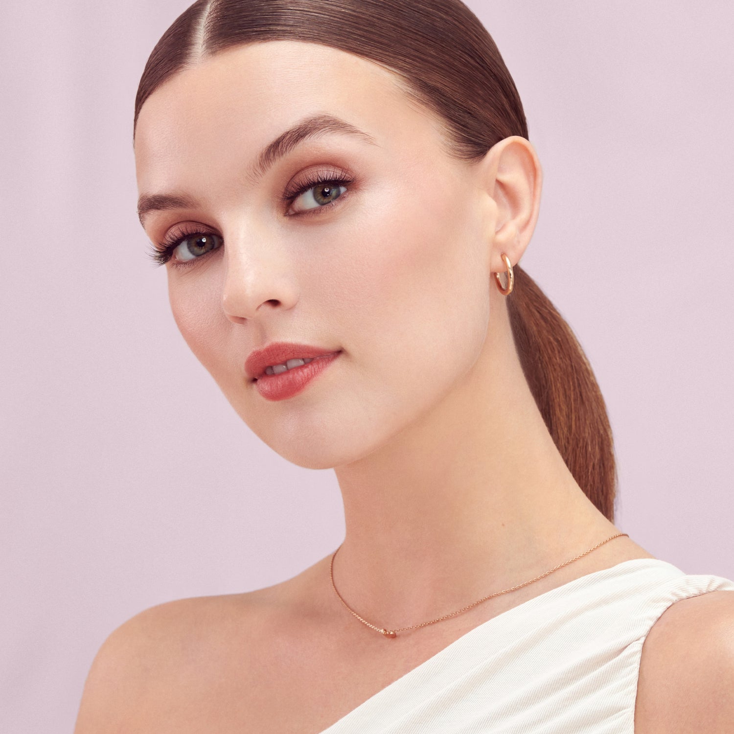 A woman wearing KISS The New Natural lashes in &